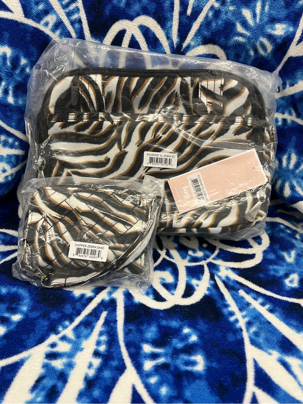 Lug Roundabout XL Crossbody Bag in Zebra Sand with Chipper Wristlet Wallet.